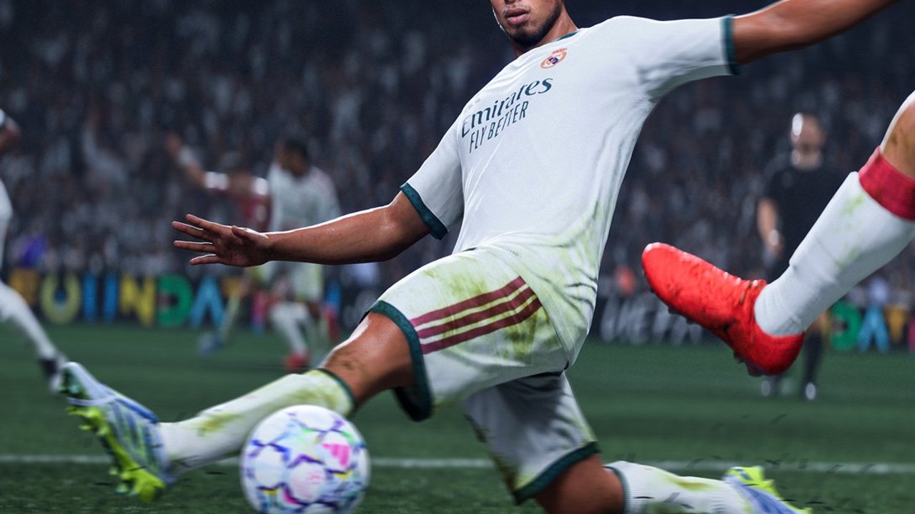 EA SPORTS FC 27 gameplay: a Real Madrid midfielder sliding to win the ball in a packed stadium